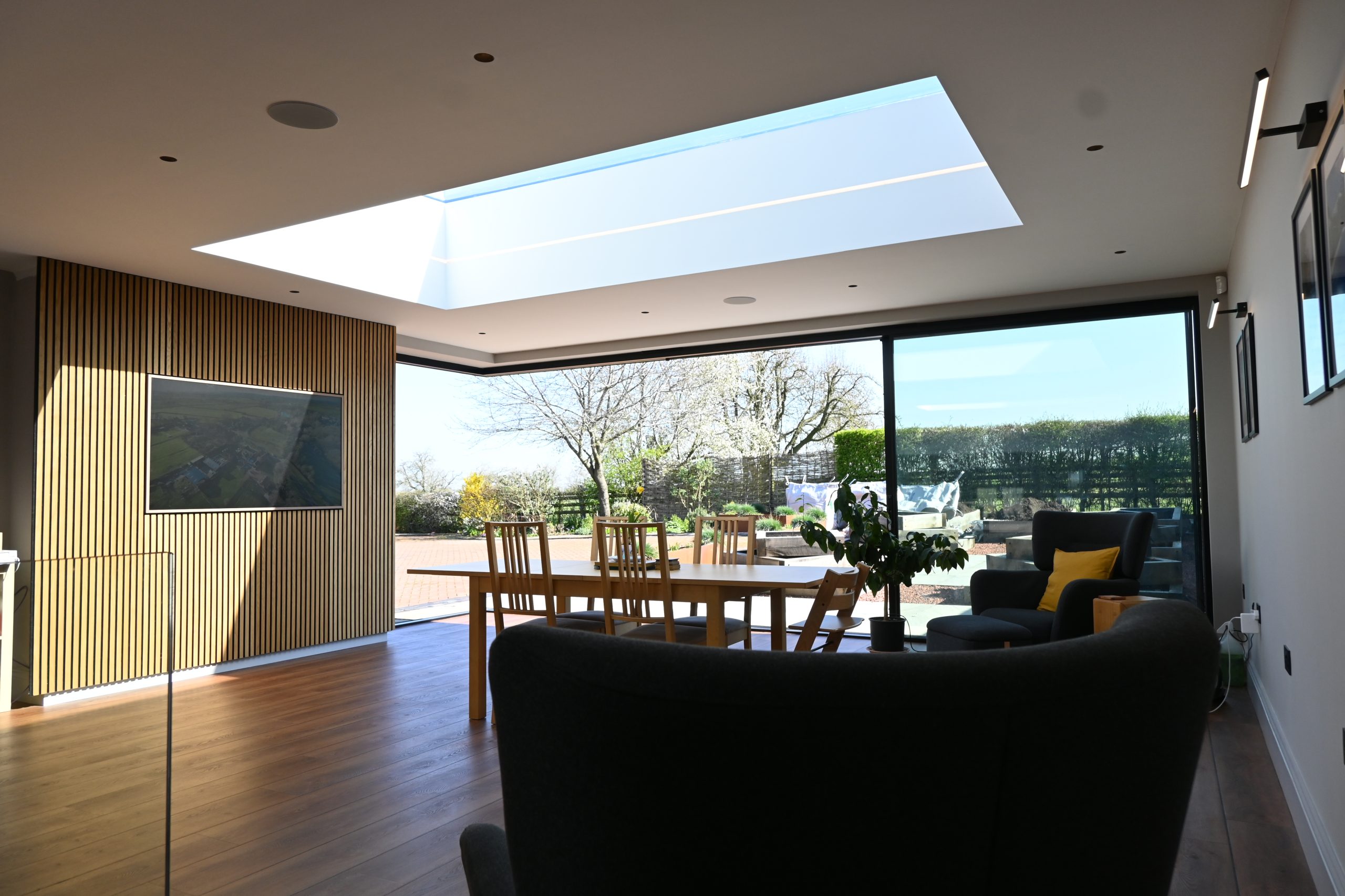 House extension interior with large rooflight and views to the garden