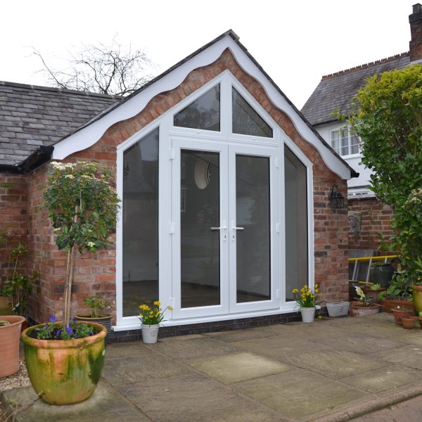 House extension with glazed gable entrance at The Stables in Fenny Drayton